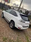 A picture of Extremely clean tokumbo standard registered white lexus rx330 with tesla