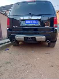 A picture of Honda Pilot 2010 model For sale my WhatsApp08064945586