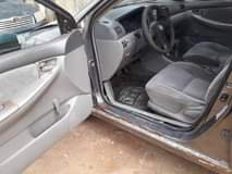 A picture of Toyota Corolla 2004 Engine Gear Ac and body needs attention