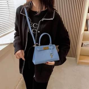 A picture of Crocodile pattern messenger bag