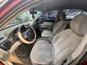 A picture of Kia Optima 2006 model Engine Gear and AC is perfect
