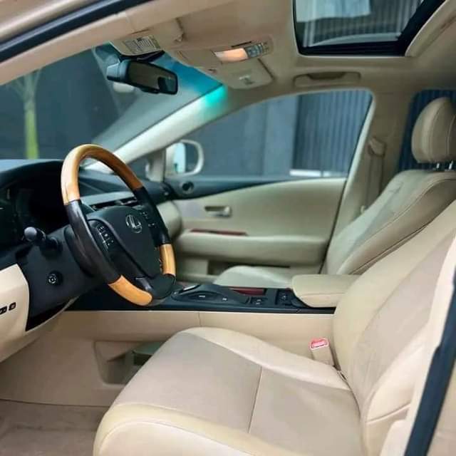 A picture of DIRECT TOKUNBO 2010 LEXUS RX350 FULL OPTION. Gold on cream