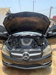 A picture of Owner is relocating he need money Urgently for this Benz