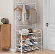 A picture of 4 layer black white hats rack lron metal adjustable shoe
