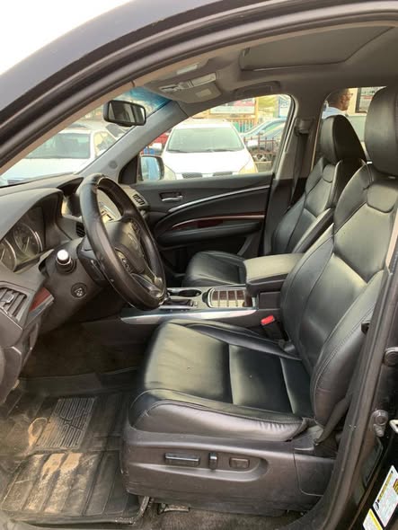 A picture of 9 months used Acura MDX 2015 modelTokunbo standard Fullest option