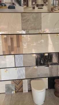 A picture of Tiles toilet seats sinks taps work tops etc