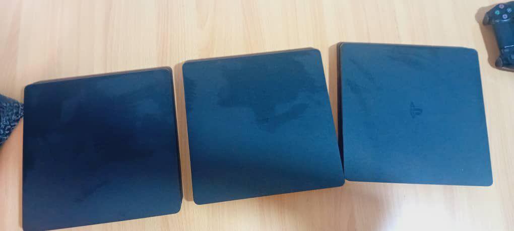A picture of 3 Ps4 consoles 8 games each 2 original UK used