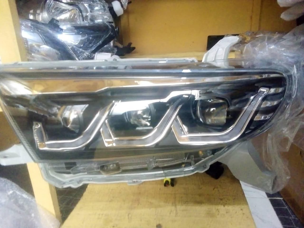 A picture of Toyota spare parts upgrading Head lamp rear light Vanza Camry