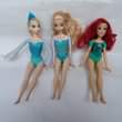 A picture of Barbie dolls