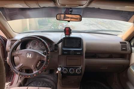 A picture of Clean Nigerian Used Wine Honda CRV 2003 Repainted Fabric interior