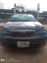 A picture of 2004 Corolla partly painted Urgent sale Everything working ok 1