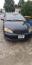 A picture of Toyota Corolla 2007 model very sharp painted engine and gear