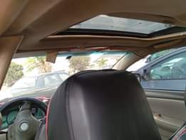 A picture of 2005 Corolla with android screen with pano roof buy and