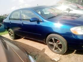 A picture of Make Toyota Model Corolla Year 2004 Color Blue Engine Perfect