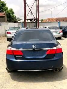 A picture of Their are about four cars on ground around central Bank