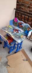 A picture of Kids reading tables
