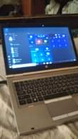 A picture of HP elite laptp pluz Aqous phone sle