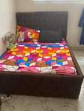 A picture of 4x6 Padded bedframe with mattress drawers