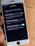 A picture of iPhone 7 Plus 32 gb battery 100 percent no finger