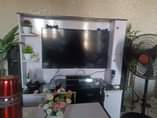A picture of Few month used tv stand