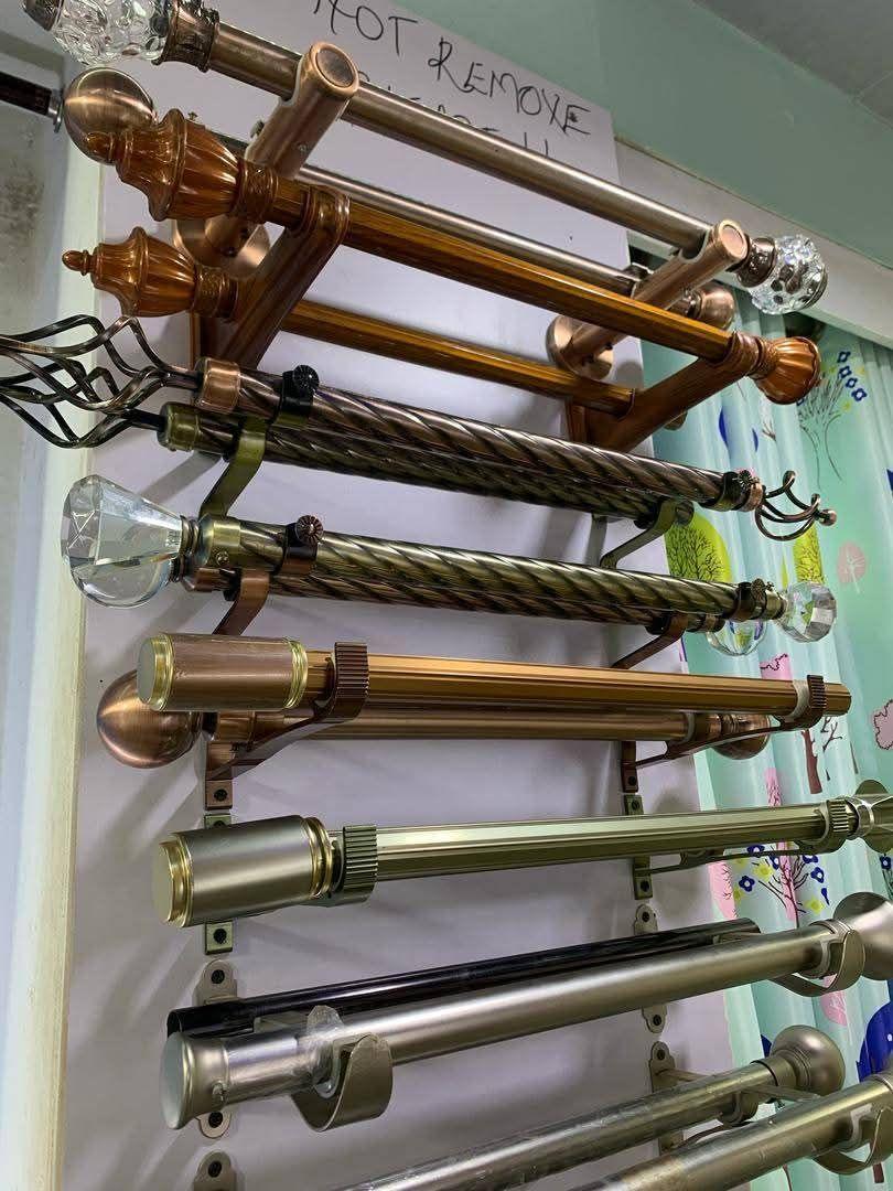 A picture of CURTAIN RODS AND ROLLS