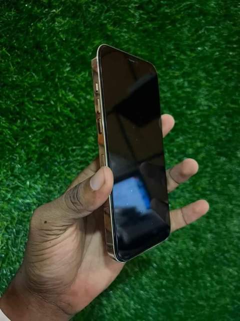 A picture of iPhone 12promax 256gib with Face ID battery 95 price