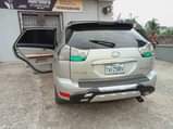 A picture of 05 pure first body Clean nd sound Lexus RX330 going