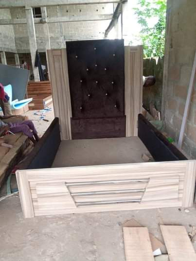 A picture of Bed frame Furniture upholstery wit brown fabric material HDF wood