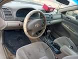 A picture of Camry naija used 2004 available for sale painted before chilling