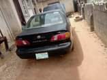 A picture of PARTIALLY FIRST BODY NIGERIA USED TOYOTA COROLLA WITH good engine