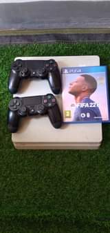 A picture of PS4 SLIM NA PAD ZAKE MBILI NA WAYA ZAKE