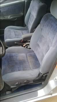 A picture of Fabric seat Manual gear Tapping glass Car situated in the