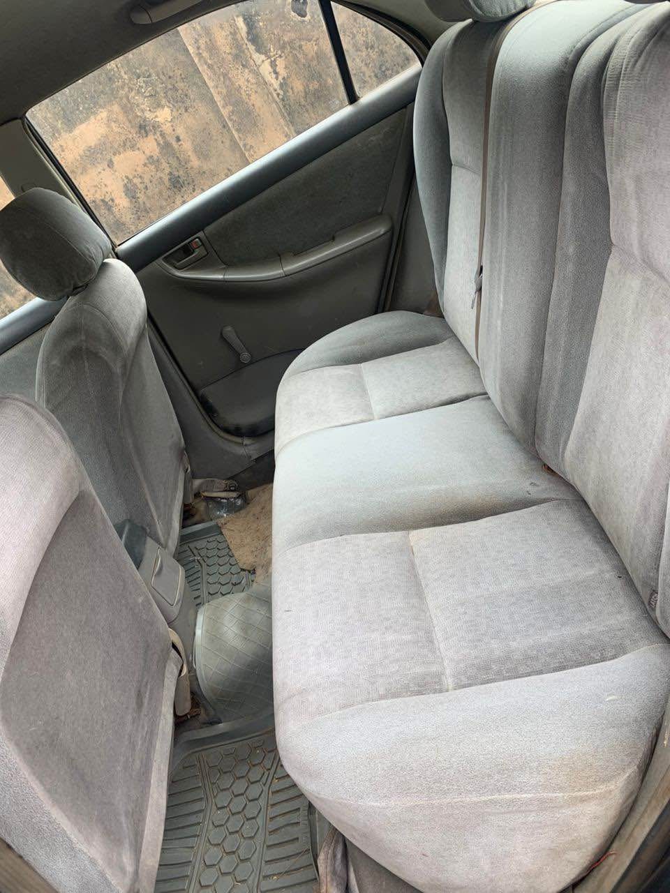 A picture of Toyota Corolla 2003 partly only the bumber is rough Ac