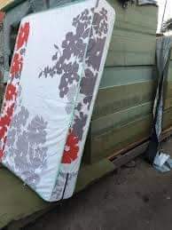 A picture of Sleeping beds and 2 pillow case