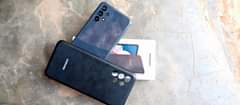 A picture of Galaxy A13 on sale I month used with its box