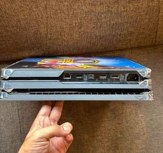 A picture of Ps4 pro 1TB with 5 games n 3 controllers 1.1M