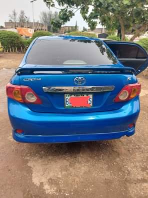 A picture of 2010 Corolla in super pristine condition repainted on first body