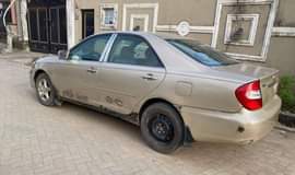 A picture of AWOOF Fastest buyer needed. 2004 Toyota Camry. Engine smoking. 1.450m