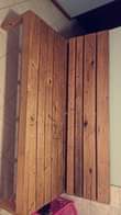 A picture of wooden couch in good condition wide and fits 4 people