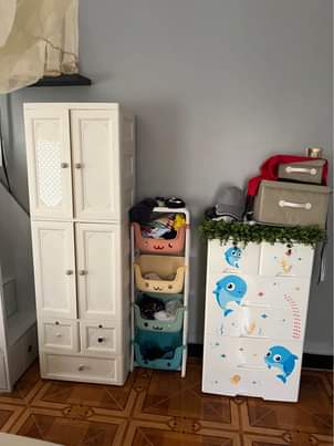 A picture of White tall babys closet 380 storage 150k short babys closet