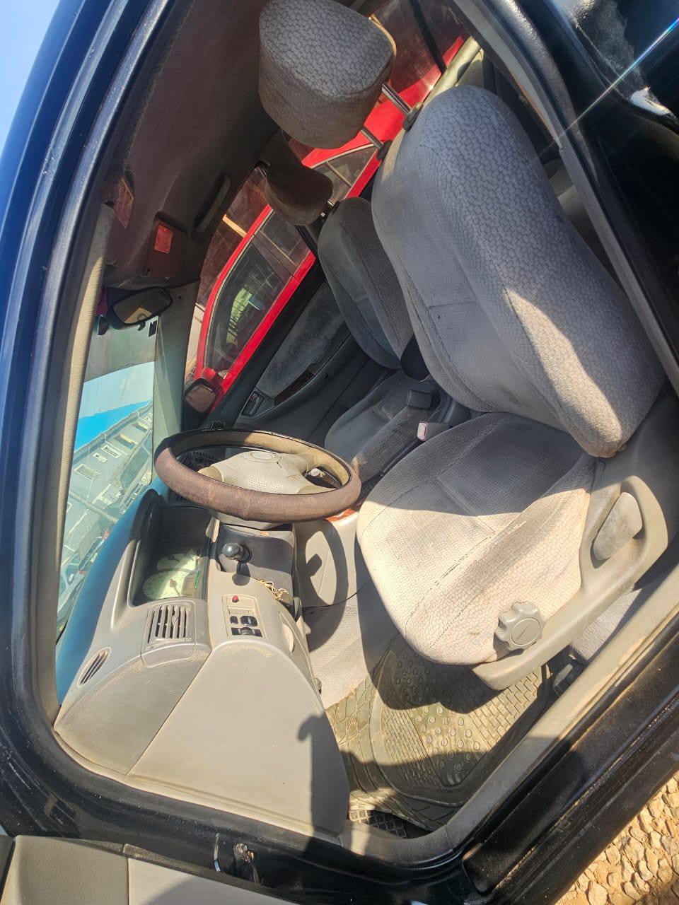 A picture of Mad Distress alert Toyota corolla 2004 with untampered engine and