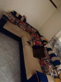 A picture of Lshaped chairs and TV