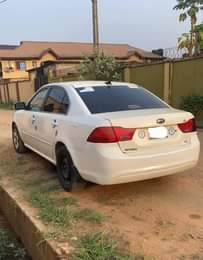A picture of Clean Nigerian Used White Kia Optima 2009