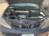 A picture of Toyota Camry 2004 4 plug Engine gear and ac are