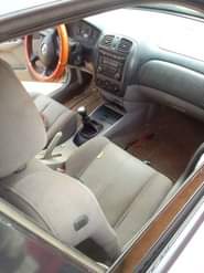 A picture of Mazda 323 for sale direct Belgium 3months used everything is
