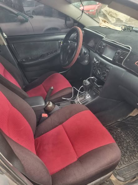 A picture of Distress Distress Distress a very clean Toyota corolla with untampered