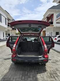 A picture of A Red Honda CR V Jeep.