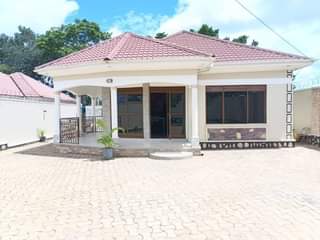 A picture of Classic white house up 4 sale Mukono_KIROWOOZA behind Uganda Christian