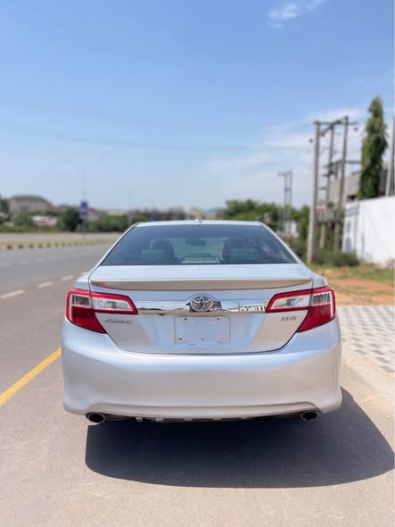 A picture of CLEAN PRE OWNED 2013 TOYOTA CAMRY XLE 10 300 000