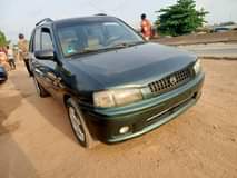 A picture of Clean Mazda 323 2004 model manual Tokunbo standard first body